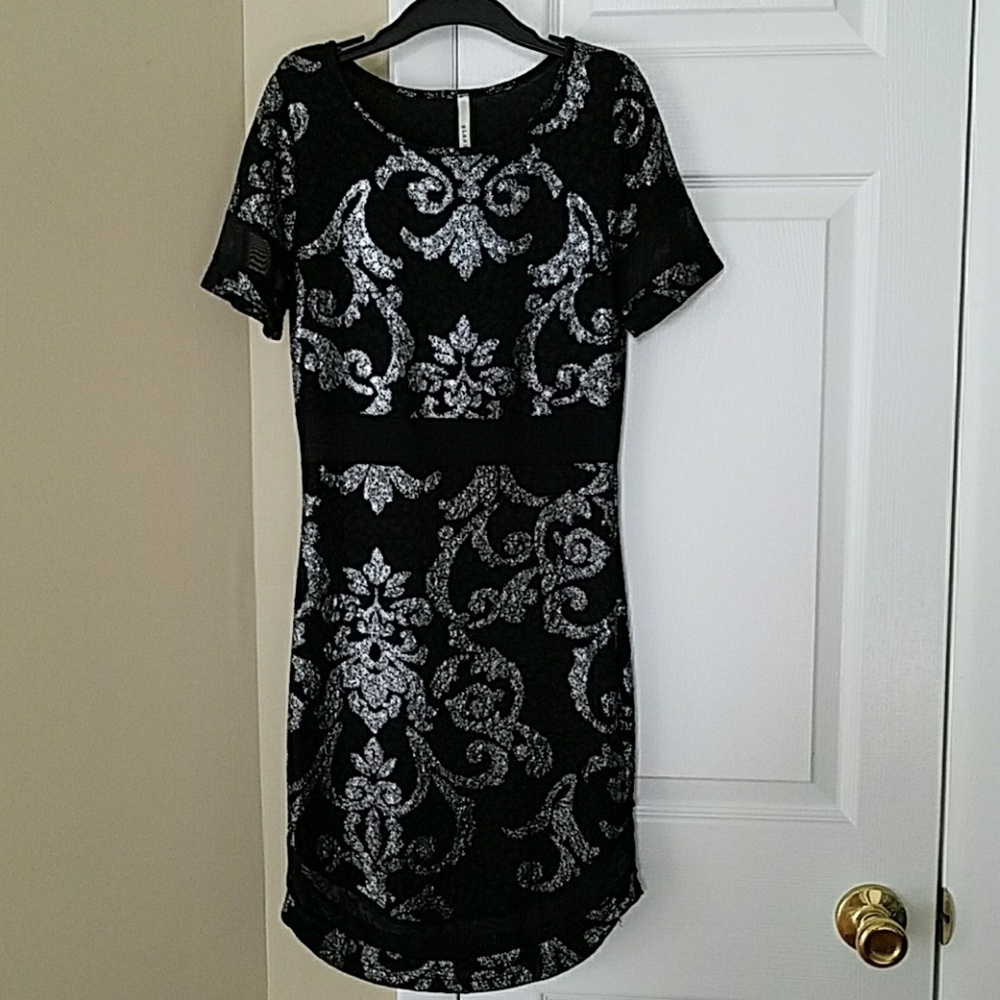 Very sleek black and silver party dress.